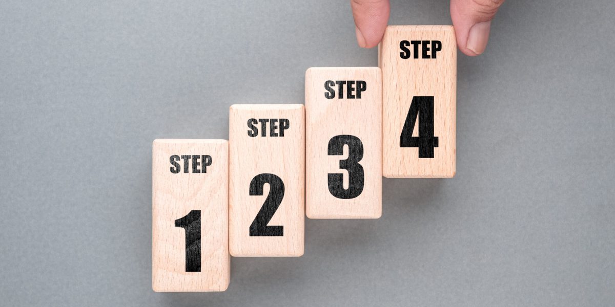 Hand arrange the wood blocks as staircase to show the step method from one to four