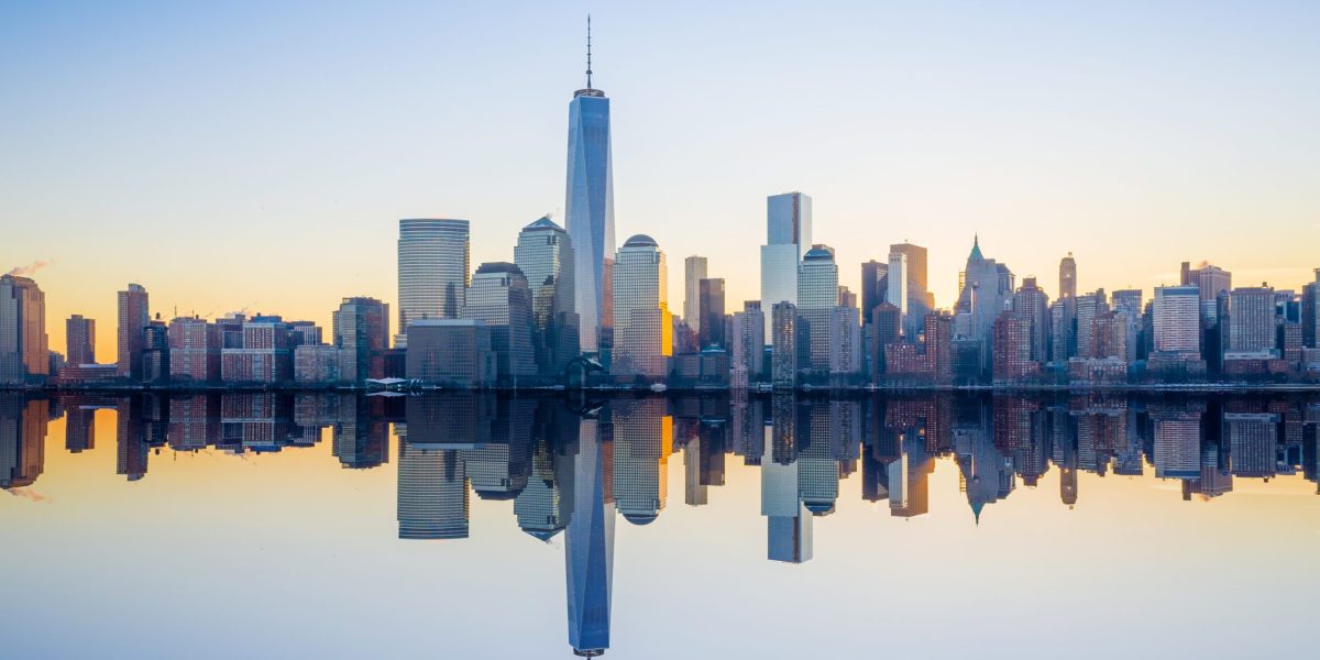 Manhattan Skyline with the One World Trade Center building at twilight, New York City